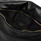 Schwarze Clutch mit goldenen Details