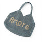 Blaue Bast-Tasche mit sandfarbenem Schriftzug "Amore"