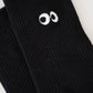 Schwarze, gerippte Socke mit Eye-Detail