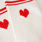 Cremefarbene Tennis-Socke mit roten Details