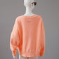 Apricotfarbenes leicht destroytes Oversize-Sweatshirt