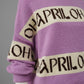 Creme/Fliederfarbener Oversize-Pullover mit Schriftzug "Oh April"