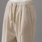 Cream-colored baby corduroy trousers with subtle lurex threads
