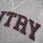 Grey sweatshirt with burgundy lettering