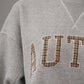 Grey sweatshirt with pink lettering