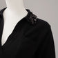 Schwarzes Strick-Polo mit Pailletten-Kragen