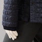 Tintenblaue, wattierte Coach-Jacke