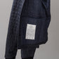 Tintenblaue, wattierte Coach-Jacke
