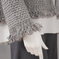 Graue Strickjacke mit Lurexfäden