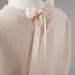 Cremefarbener Pullover mit Schleife