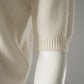 Cremefarbener Halbarm-Pullover mit Perlenausschnitt von Semicouture – Detailansicht des Ärmelbündchens