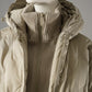 Greigefarbene Steppjacke mit Kapuze und Strickeinsatz