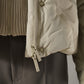 Greigefarbene Steppjacke mit Kapuze und Strickeinsatz