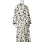 Cream-colored, polka-dotted dress with bow