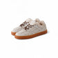 Cream-colored, lambskin-lined vintage sneaker