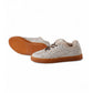 Cream-colored, lambskin-lined vintage sneaker