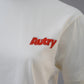Weißes T-Shirt mit orangefarbenem Schriftzug "Autry"